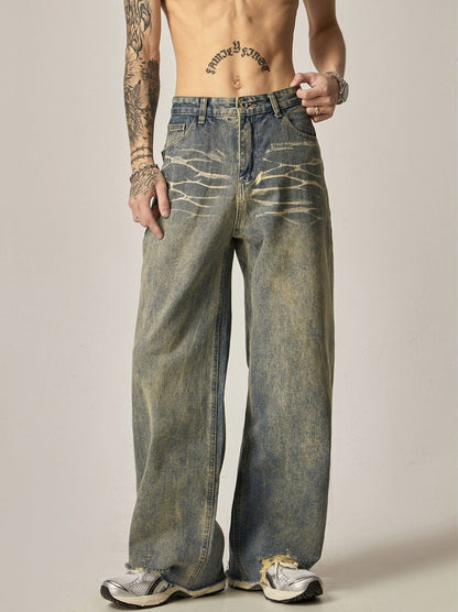 WASHED DENIM JEANS WITH DISTRESSED DETAILS