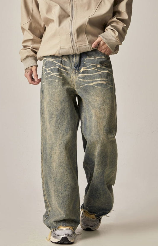 WASHED DENIM JEANS WITH DISTRESSED DETAILS