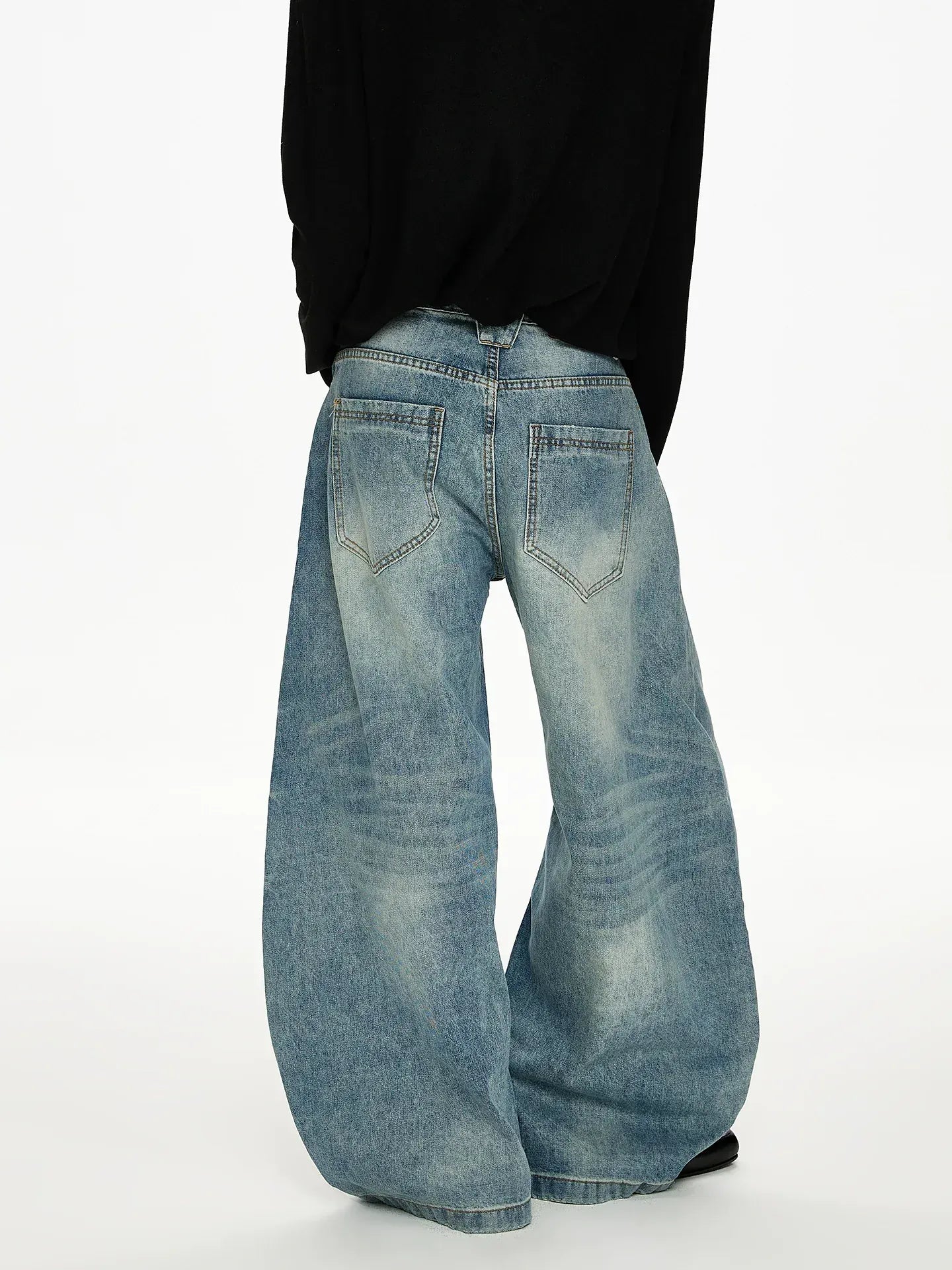 WASHED SCIMITAR DENIM JEANS